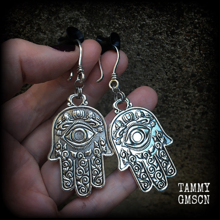 These antique silver Hamsa hand earrings weigh 10 grams each, measuring 7cms from tip to tip.
This pair has been made on small antique silver shephard hooks, suitable to be worn through stretched lobes with silicone earlets from 8 gauge (3mm).