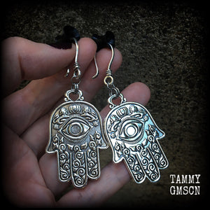 These antique silver Hamsa hand earrings weigh 10 grams each, measuring 7cms from tip to tip.
This pair has been made on small antique silver shephard hooks, suitable to be worn through stretched lobes with silicone earlets from 8 gauge (3mm).