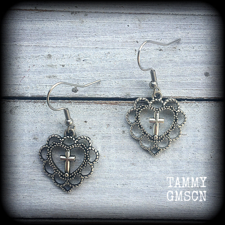 This pair of earrings features an ornate sacred heart with christian cross, nice and lightweight at just 2 grams a piece, and not too dangly, measuring just on 4cms from tip to tip.
This pair has been made with stainless steel french hooks, for pierced ears.