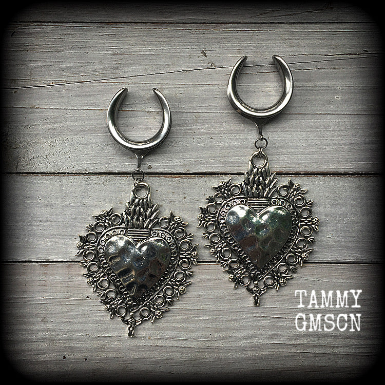 These gorgeous antique silver gauged earrings feature big beautiful sacred hearts, measuring 11cms from tip to tip, and weighing approx 21 grams each.

This pair has been made on 1" gauge (25mm) surgical steel cradles, to be worn in stretched lobes.