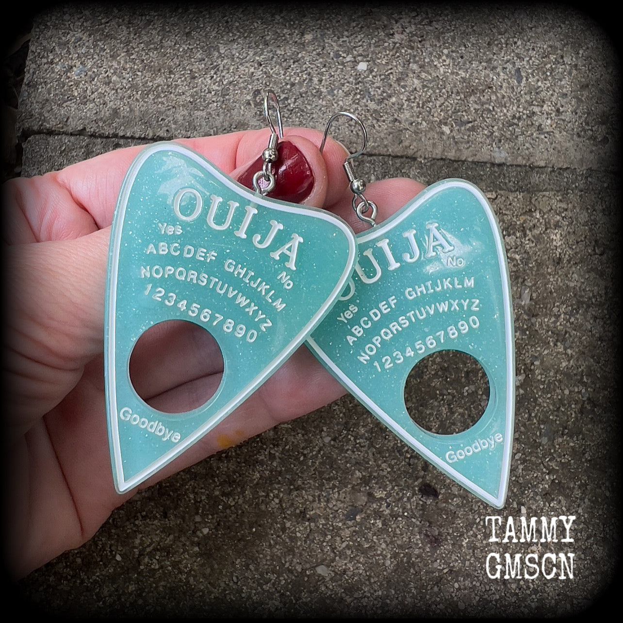 These gorgeous oversize baby blue pastel goth planchette earrings are big and dangly!!!
Weighing in at 8 grams each and measuring just under 8 cms from tip to tip.

This pair of earrings have been made on stainless steel french hooks, suitable for pierced ears.