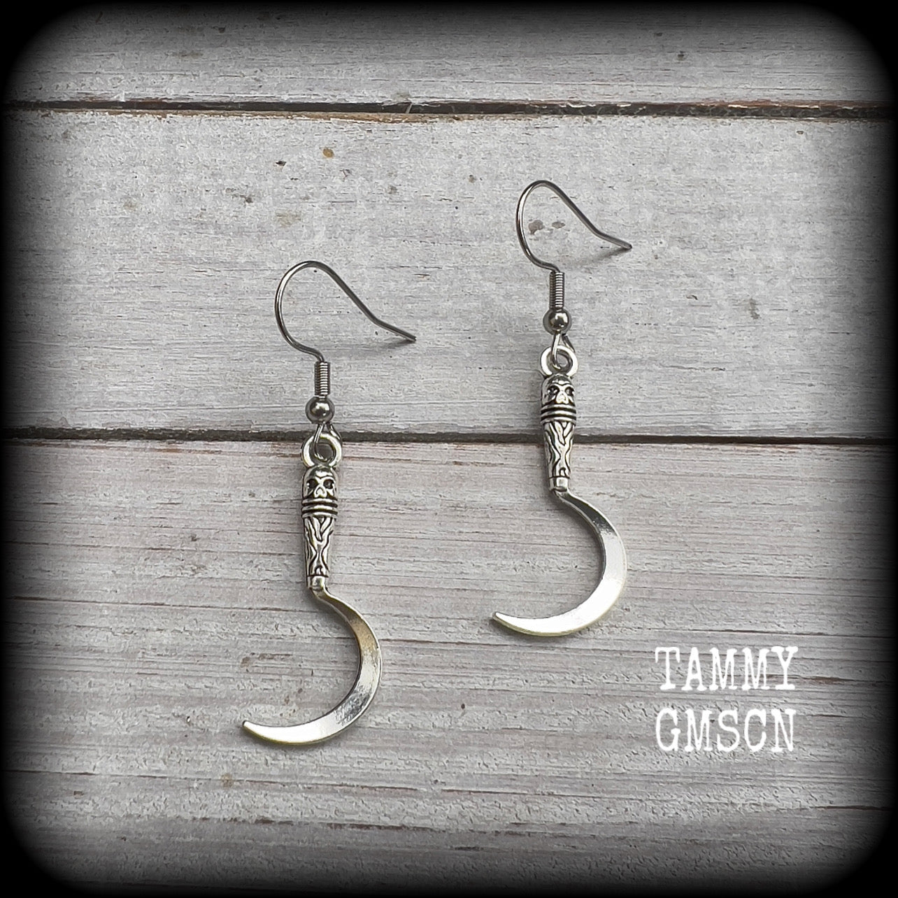 Featuring super cute super lightweight antique silver grim reaper scythes, these earrings are lovely and petite, measuring just under 5cms from tip to tip and weigh only a gram or two each.

This pair has been made with stainless steel french hooks, for pierced ears.