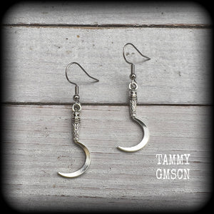 Featuring super cute super lightweight antique silver grim reaper scythes, these earrings are lovely and petite, measuring just under 5cms from tip to tip and weigh only a gram or two each.

This pair has been made with stainless steel french hooks, for pierced ears.