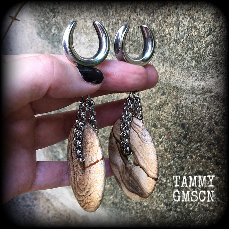 Featuring a pair of gorgeous streaky picture jasper donut gemstones cradled in sturdy stainless steel chain links, these gauged earrings weigh approx 32 grams a piece and measure just under 10cms from tip to tip.

This pair have been made on 3/4" gauge (19mm) surgical steel cradles, suitable for stretched lobes.