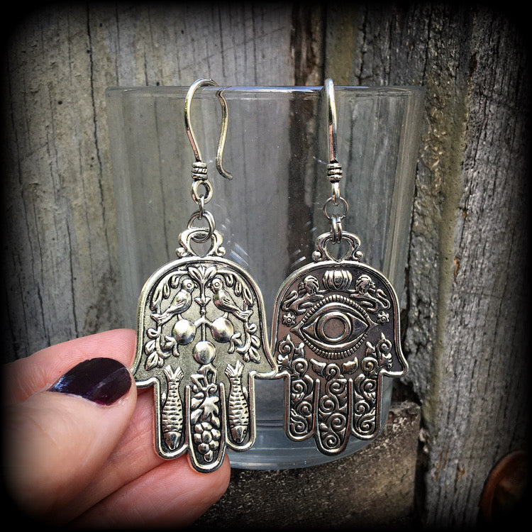 These antique silver Hamsa hand earrings weigh 10 grams each, measuring 7cms from tip to tip.
This pair has been made on small antique silver shephard hooks, suitable to be worn through stretched lobes with silicone earlets from 8 gauge (3mm).