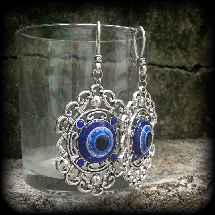 Evil eye earrings-Esoteric tunnel earrings