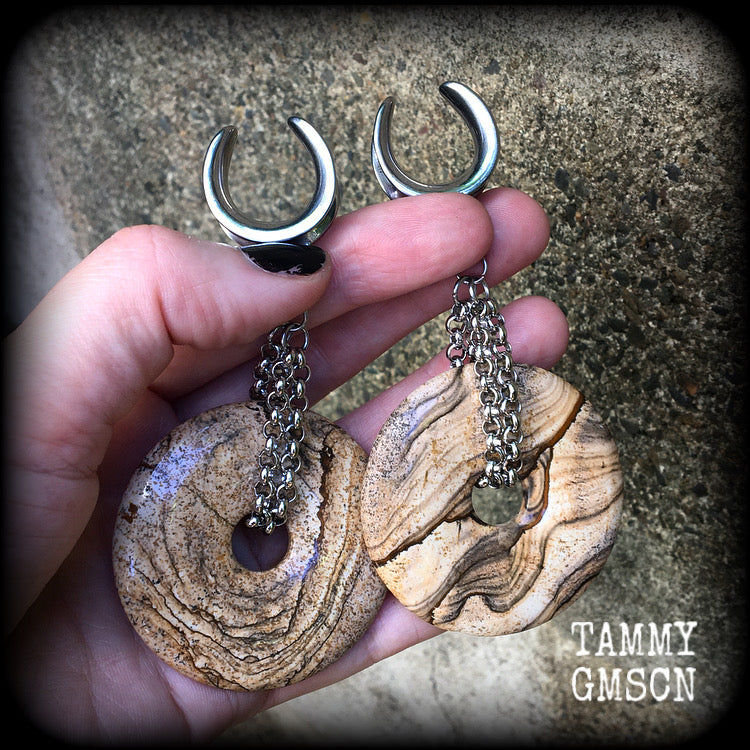 Featuring a pair of gorgeous streaky picture jasper donut gemstones cradled in sturdy stainless steel chain links, these gauged earrings weigh approx 32 grams a piece and measure just under 10cms from tip to tip.

This pair have been made on 3/4" gauge (19mm) surgical steel cradles, suitable for stretched lobes.