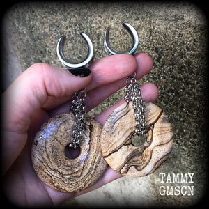 Featuring a pair of gorgeous streaky picture jasper donut gemstones cradled in sturdy stainless steel chain links, these gauged earrings weigh approx 32 grams a piece and measure just under 10cms from tip to tip.

This pair have been made on 3/4" gauge (19mm) surgical steel cradles, suitable for stretched lobes.