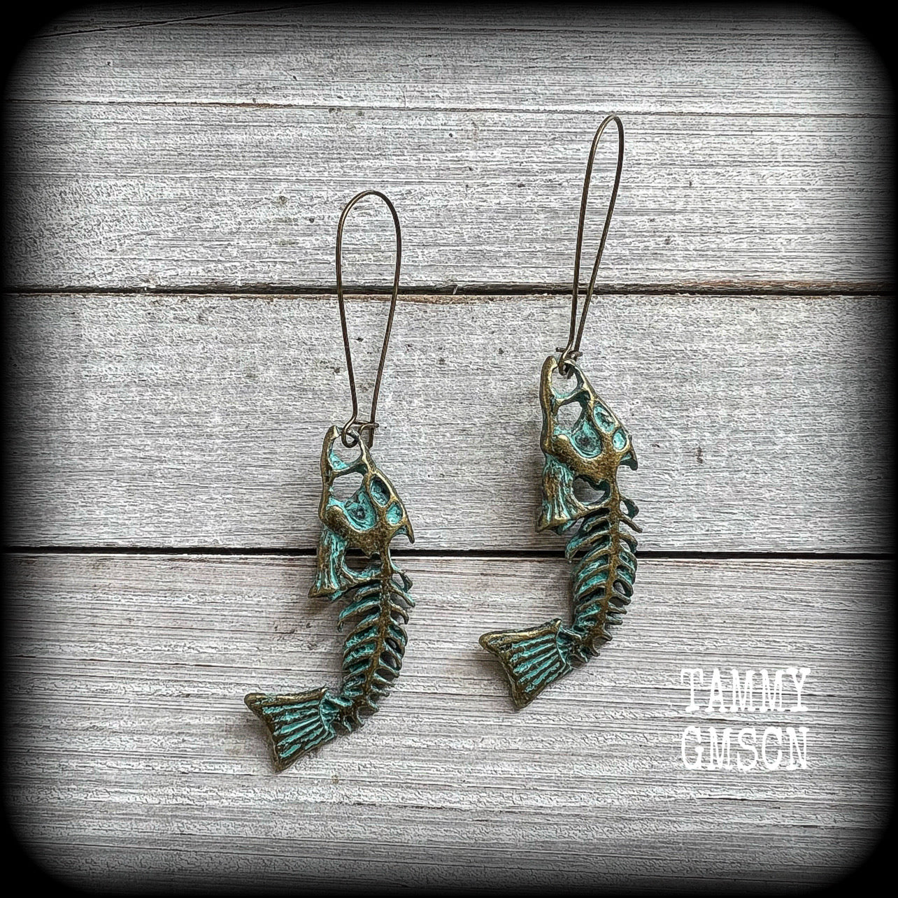 Patina fish skeleton earrings