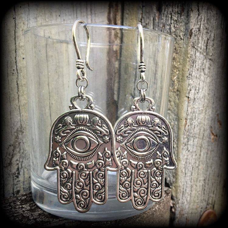 These antique silver Hamsa hand earrings weigh 10 grams each, measuring 7cms from tip to tip.
This pair has been made on small antique silver shephard hooks, suitable to be worn through stretched lobes with silicone earlets from 8 gauge (3mm).