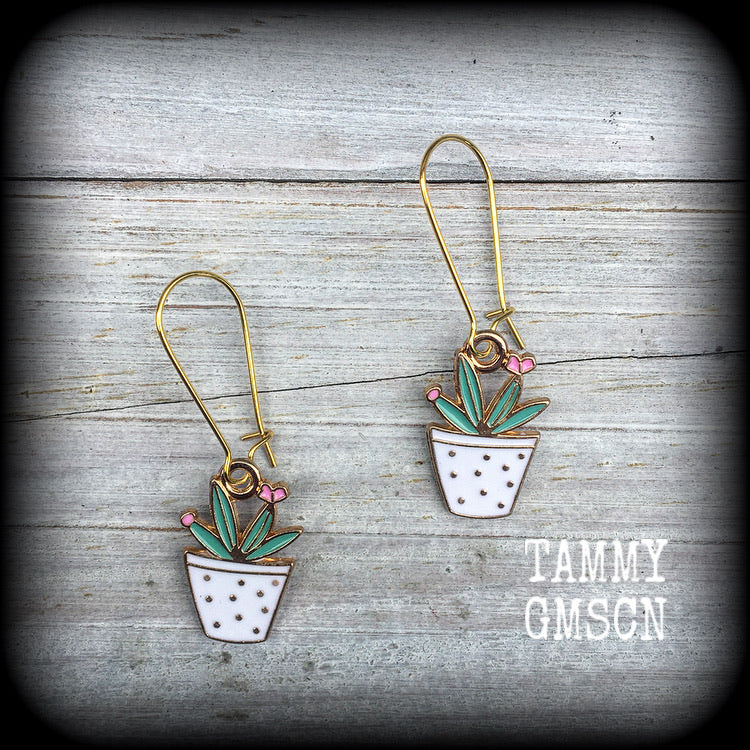 Cactus earrings Succulent earrings Aloe vera earrings Snake plant Crazy plant people Pierced ears Ear gauges Ear hangers Tunnels Plugs Green CIPPA earrings Cactus jewelry Desert earrings Trailer trash jewelry Retro earrings Kitsch earrings
