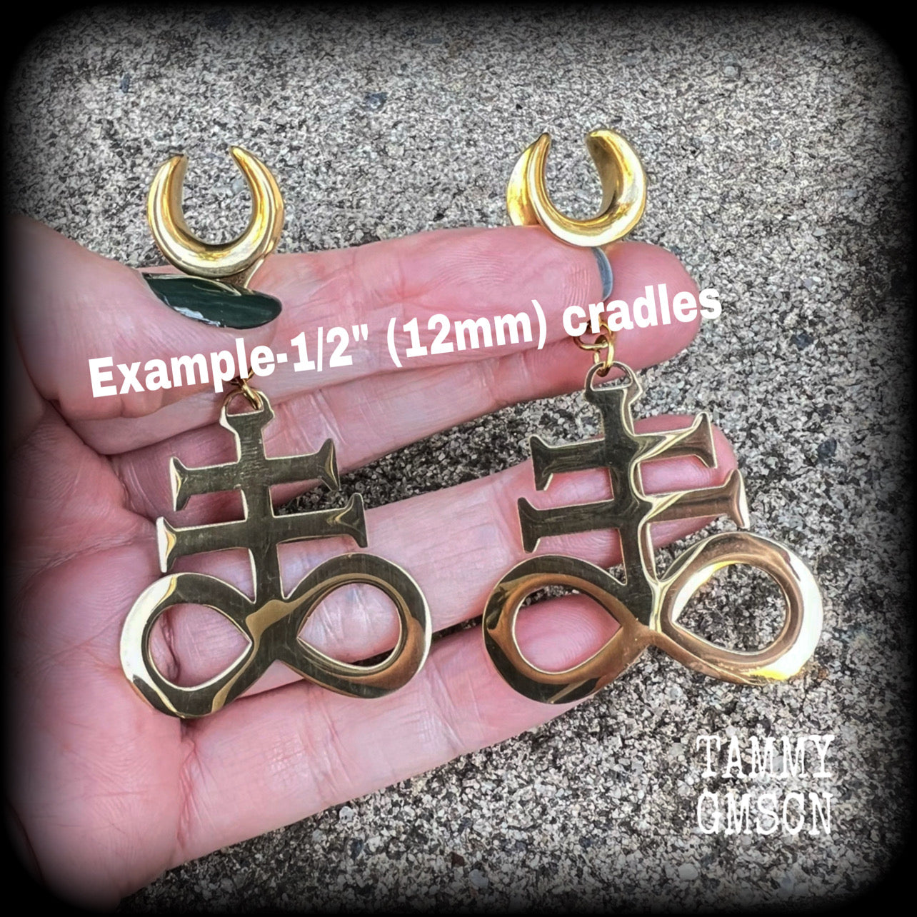 These gorgeous gold titanium earrings feature large Sigil of sulphur brimstone charms, weighing approx 8 grams each, and measuring around 7 cms from tip to tip.
This pair has been made on 1/2" gauge (12mm) surgical steel cradles, to be worn in stretched lobes.
