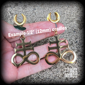 These gorgeous gold titanium earrings feature large Sigil of sulphur brimstone charms, weighing approx 8 grams each, and measuring around 7 cms from tip to tip.
This pair has been made on 1/2" gauge (12mm) surgical steel cradles, to be worn in stretched lobes.