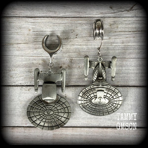 These awesome Star Trek USS Enterprise ear hangers feature a gorgeous big pewter Enterprise pendant, measuring just over 9cms from tip to tip, and weighing approx 37 grams each, nice and heavy.

This pair has been made on 5/8" gauge (16mm) surgical steel cradles, to be worn in stretched lobes.
