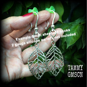 These beautiful earrings feature an antique silver skeleton leaf, measuring just on 7cms from tip to tip, and weighing approx 6 grams each.
This pair have been made on antique silver large shephard hooks, suitable for stretched ears.