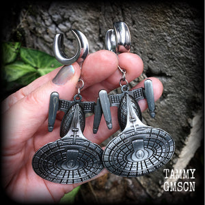 These awesome Star Trek USS Enterprise ear hangers feature a gorgeous big pewter Enterprise pendant, measuring just over 9cms from tip to tip, and weighing approx 37 grams each, nice and heavy.

This pair has been made on 5/8" gauge (16mm) surgical steel cradles, to be worn in stretched lobes.
