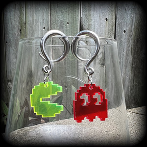 These super rad earrings feature classic acrylic pixelated Pac man and Blinky charms, measuring 5 cms from tip to tip, weighing in at only 4 grams each.
This pair has been made on 6 gauge (4mm) surgical steel full curl hooks, suitable for stretched lobes.