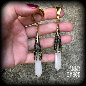 These gorgeous gothic gemstone gauged earrings feature beautiful cloudy quartz and antique bronze gemstone points, measuring just over 10 cms from tip to tip, and weighing approx 15 grams each.
These earrings have been made on 5/8" gauge (16mm) surgical steel saddles, to be worn in stretched lobes.