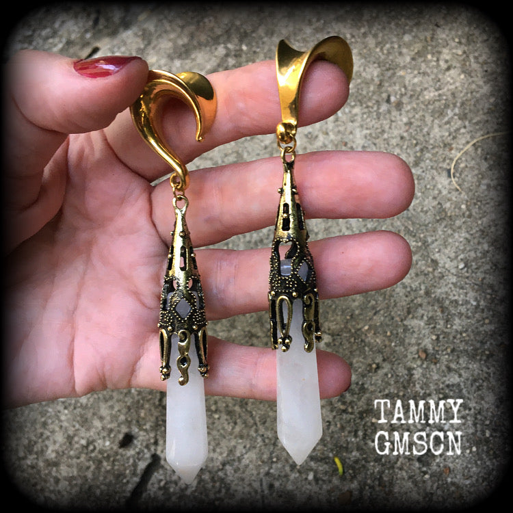 These gorgeous gothic gemstone gauged earrings feature beautiful cloudy quartz and antique bronze gemstone points, measuring just over 10 cms from tip to tip, and weighing approx 15 grams each.
These earrings have been made on 5/8" gauge (16mm) surgical steel saddles, to be worn in stretched lobes.