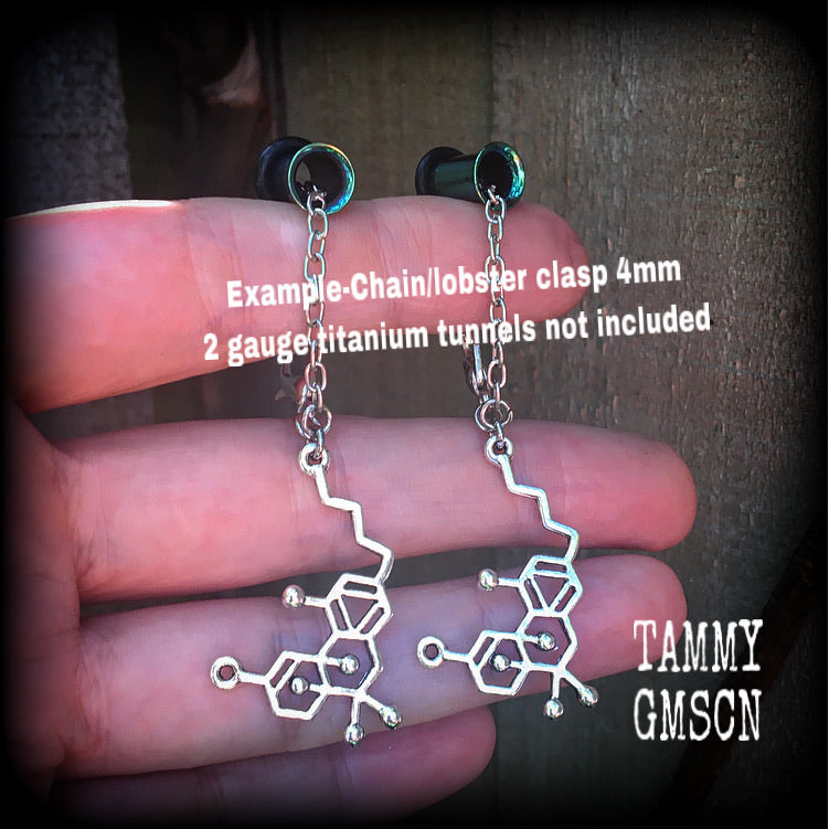 These adorable antique silver THC molecule earrings measure just over 6cms from tip to tip, weighing only a few grams.
This pair have been made with chain and lobster clasp 4mm to be worn in earlets and tunnels in stretched lobes from 6 gauge (4mm).