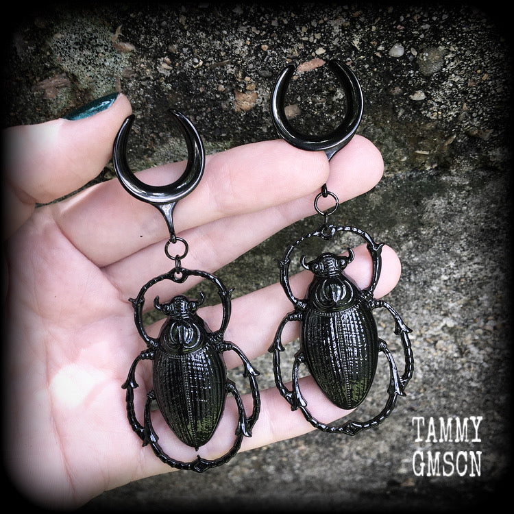 These gorgeous black enamel 'Scarab beetle' gauged earrings measure approx 9cms from tip to tip, and weigh approx. 16 grams a piece, not too heavy.
This pair has been made on 3/4" gauge (19mm) gauge surgical steel cradles, to be worn in stretched lobes.