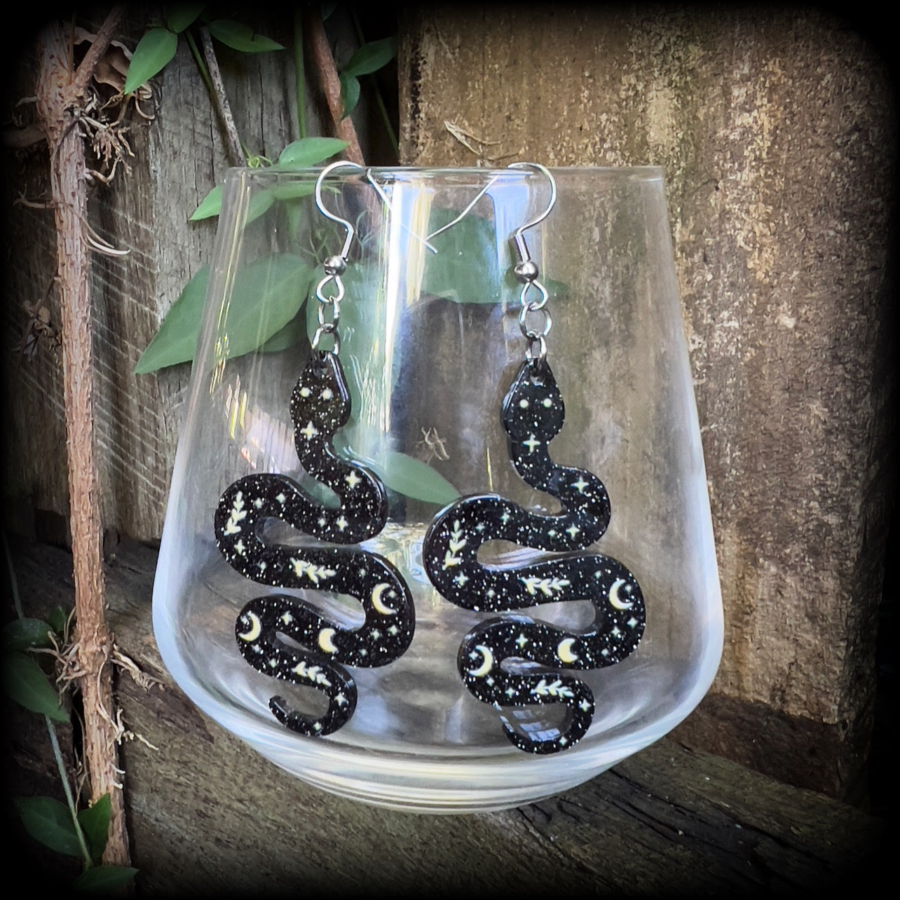 These earrings feature a beautiful black celestial patterned snake, measuring just over 7cms from tip to tip, and are super lightweight at only a few grams each.
This pair have been made with stainless steel french hooks, suitable for pierced ears.
