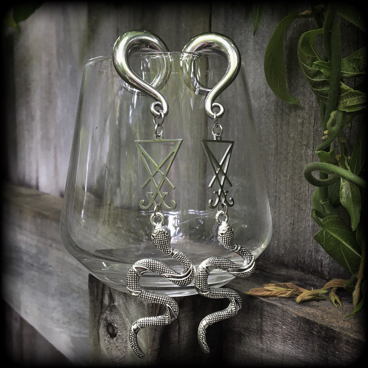 These gorgeous 'Snake and Sigil' gauged earrings feature an antique silver snake (Lilith) hanging from a stainless steel Sigil of Lucifer charm.
These are nice and dangly at 12cms from tip to tip and weigh approx 20 grams each, not too heavy.
This pair have been made on 0 gauge (8mm) surgical steel full curl hooks, suitable for stretched lobes.