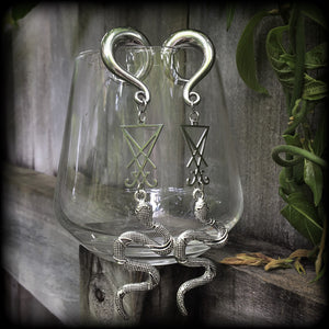 These gorgeous 'Snake and Sigil' gauged earrings feature an antique silver snake (Lilith) hanging from a stainless steel Sigil of Lucifer charm.
These are nice and dangly at 12cms from tip to tip and weigh approx 20 grams each, not too heavy.
This pair have been made on 0 gauge (8mm) surgical steel full curl hooks, suitable for stretched lobes.