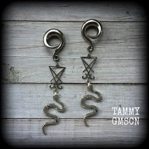 These gorgeous 'Snake and Sigil' gauged earrings feature an antique silver snake (Lilith) hanging from a stainless steel Sigil of Lucifer charm.
These are nice and dangly at 12cms from tip to tip and weigh approx 20 grams each, not too heavy.
This pair have been made on 0 gauge (8mm) surgical steel full curl hooks, suitable for stretched lobes.
