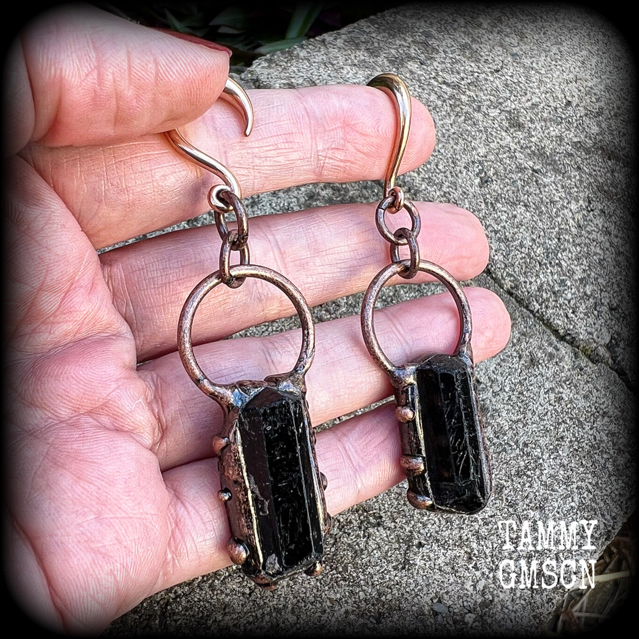 Featuring a pair of beautiful raw black tourmaline gemstones enclosed in rustic ornate copper plate detail, this pair of gorgeous gauged earrings weighs approx 16 grams a piece, and measure approx 8cms from tip to tip.

This pair have been made on 6 gauge (4mm) rose gold titanium coated surgical steel half curl hooks, suitable for stretched lobes.

