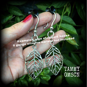 These beautiful earrings feature an antique silver skeleton leaf, measuring just on 7cms from tip to tip, and weighing approx 6 grams each.
This pair have been made on antique silver large shephard hooks, suitable for stretched ears.