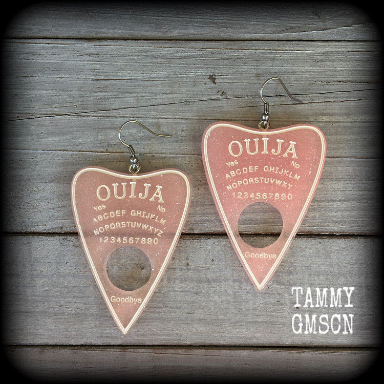 These gorgeous oversize pastel goth acrylic planchette earrings are big and dangly, weighing in at 8 grams each and measuring just under 8cms from tip to tip.

This pair have been made on stainless steel french hooks, suitable for pierced ears.
