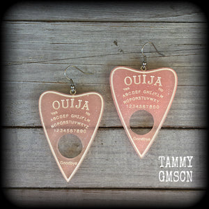 These gorgeous oversize pastel goth acrylic planchette earrings are big and dangly, weighing in at 8 grams each and measuring just under 8cms from tip to tip.

This pair have been made on stainless steel french hooks, suitable for pierced ears.