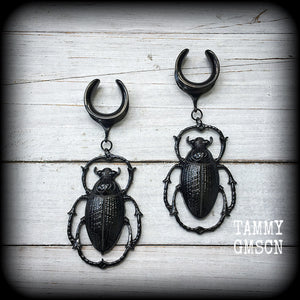 These gorgeous black enamel 'Scarab beetle' gauged earrings measure approx 9cms from tip to tip, and weigh approx. 16 grams a piece, not too heavy.
This pair has been made on 3/4" gauge (19mm) gauge surgical steel cradles, to be worn in stretched lobes.