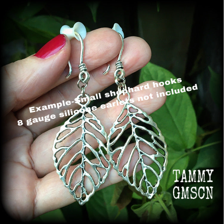 These beautiful earrings feature an antique silver skeleton leaf, measuring just on 7cms from tip to tip, and weighing approx 6 grams each.
This pair have been made on antique silver small shephard hooks, suitable for stretched ears.