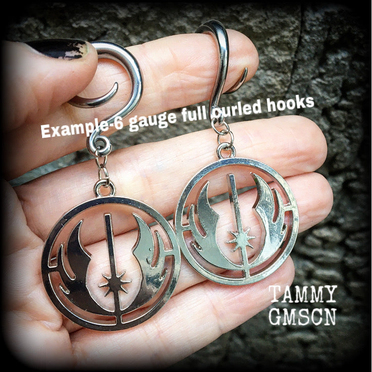 Featuring the symbol of the Jedi Order, these earrings are nice and lightweight at only 9 grams a piece, and measure just over 6cms from tip to tip, a must have for any Star Wars fan!

This pair has been made on 6 gauge (4mm) surgical steel full curls, to be worn in stretched lobes.