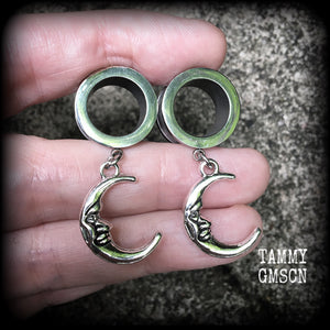 These gorgeous tunnel dangles feature whimsical antique silver crescent moons, are light weight, weighing in at 7 grams each and measure 4 cms from tip to tip.
This pair has been made with 9/16" (14mm) gauge surgical steel screw fit tunnels-suitable for stretched lobes.