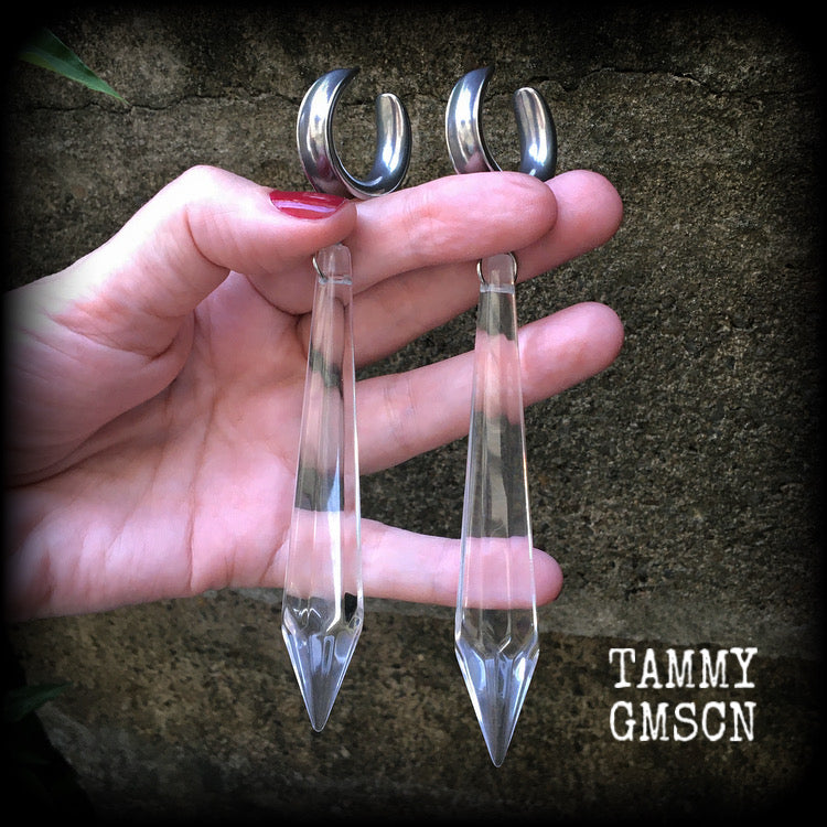 These gorgeous dangly glass earrings have been made with gorgeous faceted clear glass spears, measuring 13 cms from tip to tip, and weighing approx 13 grams each.

These earrings have been made on 3/4" gauge (19mm) surgical steel cradles, to be worn in stretched lobes.