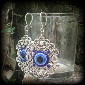 Evil eye earrings-Esoteric tunnel earrings