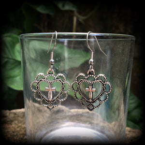 This pair of earrings features an ornate sacred heart with christian cross, nice and lightweight at just 2 grams a piece, and not too dangly, measuring just on 4cms from tip to tip.
This pair has been made with stainless steel french hooks, for pierced ears.