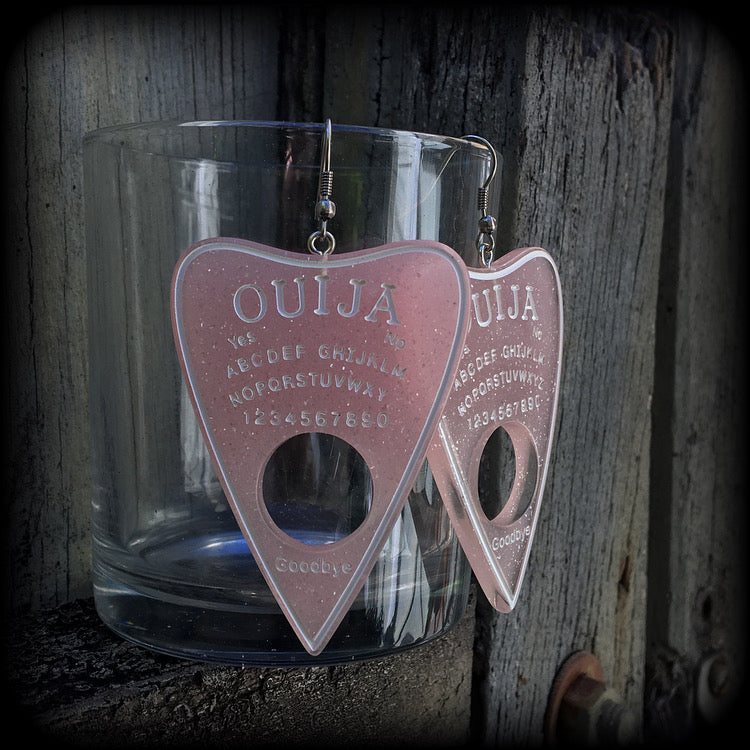 These gorgeous oversize pastel goth acrylic planchette earrings are big and dangly, weighing in at 8 grams each and measuring just under 8cms from tip to tip.

This pair have been made on stainless steel french hooks, suitable for pierced ears.