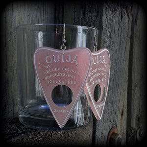 These gorgeous oversize pastel goth acrylic planchette earrings are big and dangly, weighing in at 8 grams each and measuring just under 8cms from tip to tip.

This pair have been made on stainless steel french hooks, suitable for pierced ears.