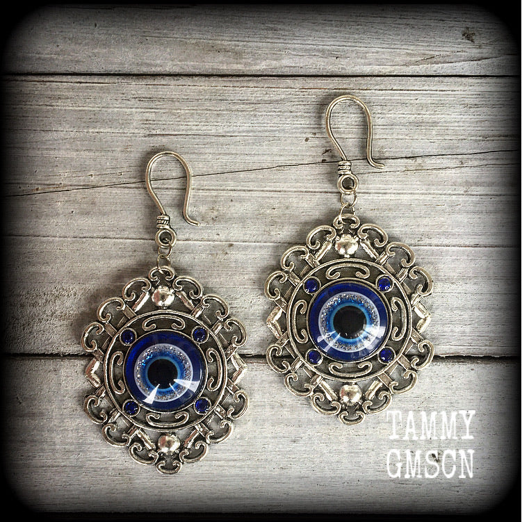 Evil eye earrings-Esoteric tunnel earrings