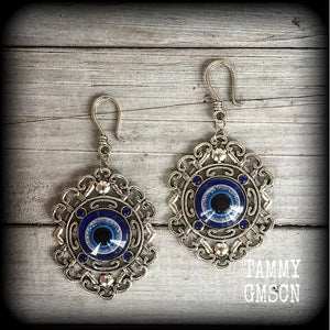 Evil eye earrings-Esoteric tunnel earrings