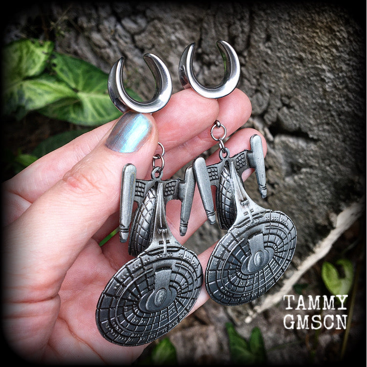 These awesome Star Trek USS Enterprise ear hangers feature a gorgeous big pewter Enterprise pendant, measuring just over 9cms from tip to tip, and weighing approx 37 grams each, nice and heavy.

This pair has been made on 5/8" gauge (16mm) surgical steel cradles, to be worn in stretched lobes.
