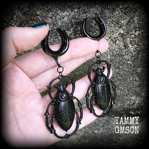 These gorgeous black enamel 'Scarab beetle' gauged earrings measure approx 9cms from tip to tip, and weigh approx. 16 grams a piece, not too heavy.
This pair has been made on 3/4" gauge (19mm) gauge surgical steel cradles, to be worn in stretched lobes.