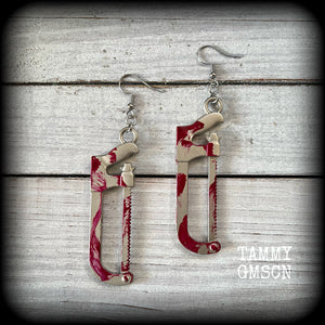 Bone saw earrings Hack saw earrings Halloween earrings Murder weapon True crime earrings Blood spatter Horrorpunk earrings Haooror punk jewelry Horror movies Slasher movies Pierced ears Ear gauges Mortuary equipment Medical instruments Zombie earring