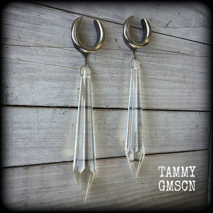 These gorgeous dangly glass earrings have been made with gorgeous faceted clear glass spears, measuring 13 cms from tip to tip, and weighing approx 13 grams each.

These earrings have been made on 3/4" gauge (19mm) surgical steel cradles, to be worn in stretched lobes.