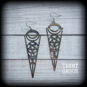 These earrings feature gorgeous esoteric crescent moon and pentagram designs, are super light weight and nice and dangly, weighing only a gram or two each, and measuring just over 9cms from tip to tip.
This pair has been made with stainless steel french hooks, to be worn through pierced ears.