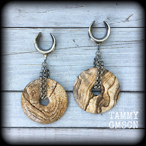 Featuring a pair of gorgeous streaky picture jasper donut gemstones cradled in sturdy stainless steel chain links, these gauged earrings weigh approx 32 grams a piece and measure just under 10cms from tip to tip.

This pair have been made on 3/4" gauge (19mm) surgical steel cradles, suitable for stretched lobes.